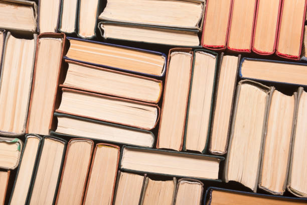 istock Old and used hardback books or text books from above. 1205302598