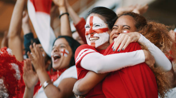 istock English spectators celebrating their team's victory 1205302848