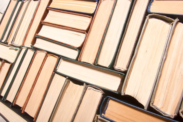 istock Old and used hardback books or text books from above. 1205302916