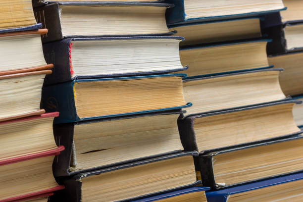 istock Old and used hardback books or text books from above. 1205303393