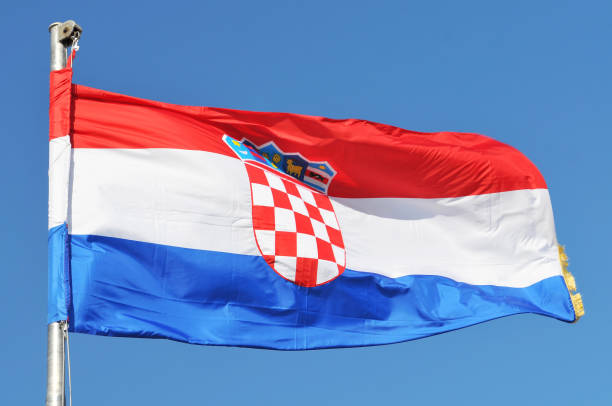 istock Croatian flag over the blue sky. 1205305801