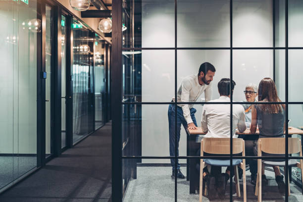 istock Business persons on a meeting in a small conference room 1205306626
