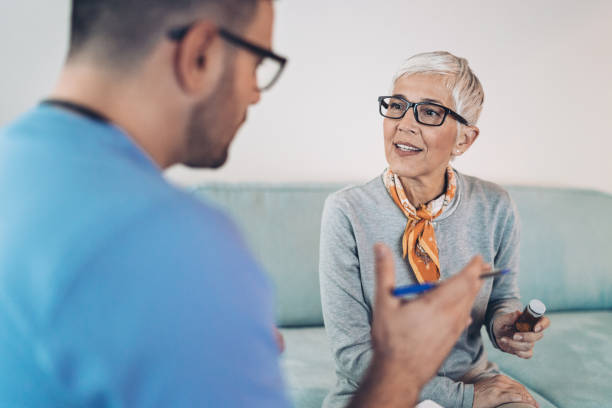istock Senior woman talking to a doctor 1205306642
