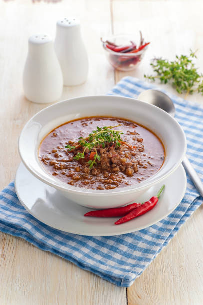 istock Hamburger cauliflower soup. Hot minced meat soup with cauliflower, vegetables and cheese. 1205309644