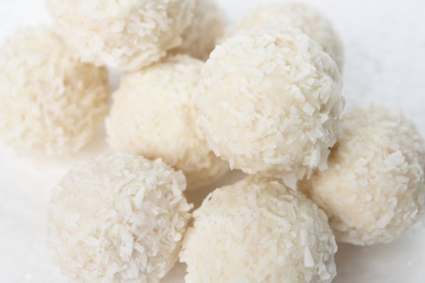 istock Sweets with almonds and coconut closeup on a white background 1205310689