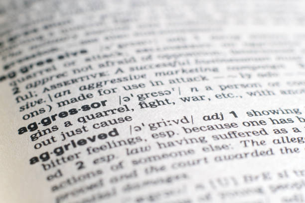 istock A close-up on a word Aggressor in English dictionary (selective focus) 1205311064
