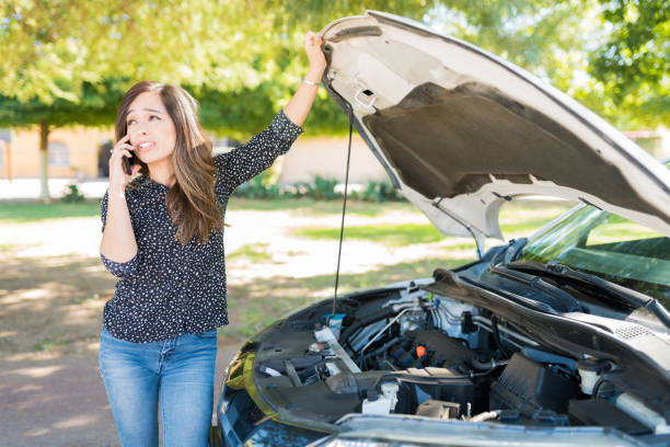 istock Woman Calling For Assistance On Phone During Car Breakdown 1205312378