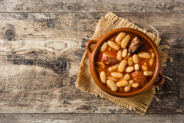 Typical Spanish Fabada Asturian Typical Spanish fabada asturiana on wooden table stew photos stock pictures, royalty-free photos & images
