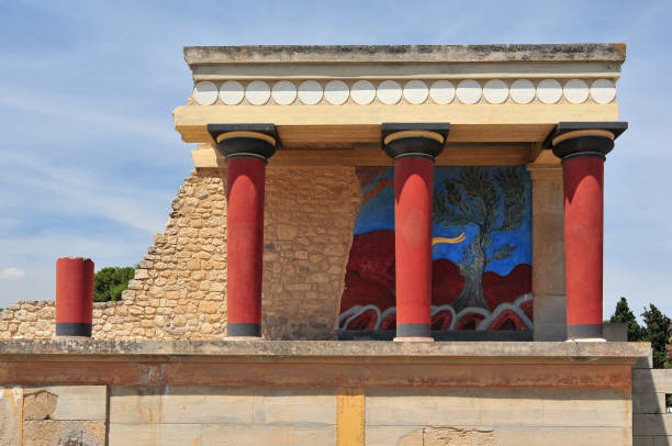 View of the Minoan Palace of Knossos with characteristic columns and a fresco of a bull behind. Crete, Greece. View of the Minoan Palace of Knossos with characteristic columns and a fresco of a bull behind. Crete, Greece. arhanes stock pictures, royalty-free photos & images