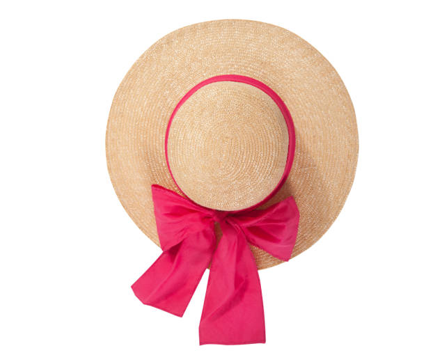 istock Pretty straw hat with ribbon and bow on white background. Beach hat top view isolated 1205312695