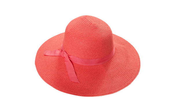 istock Pretty straw hat with ribbon and bow on white background. Beach hat top view isolated 1205312703