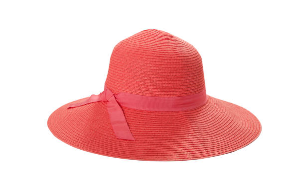istock Pretty straw hat with ribbon and bow on white background. Beach hat top view isolated 1205312710
