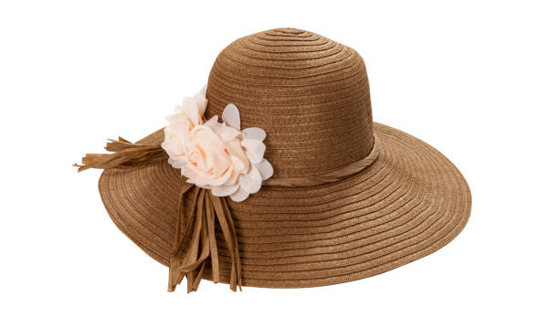 istock Pretty straw hat with ribbon and bow on white background. Beach hat top view isolated 1205312711