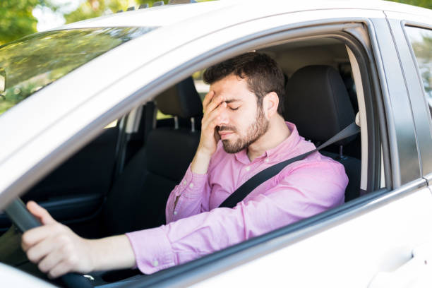 istock Annoyed Man In Car At Traffic 1205312811