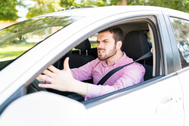 istock Angry Man Screaming In Car During Traffic 1205312845