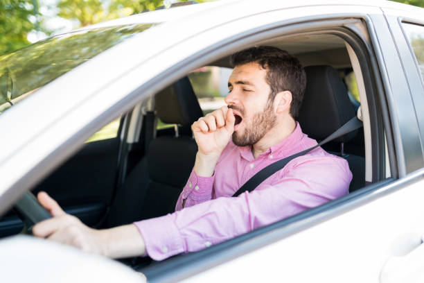 istock Man Driving Car Feeling Bored In Traffic 1205312886