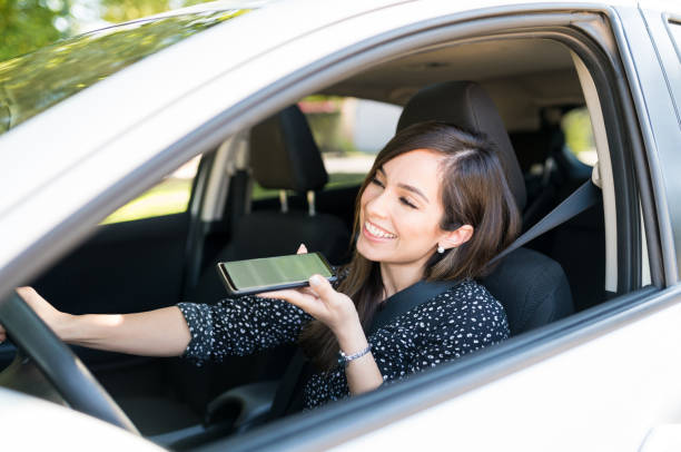 istock Woman Talking On Cellphone In Car 1205313713