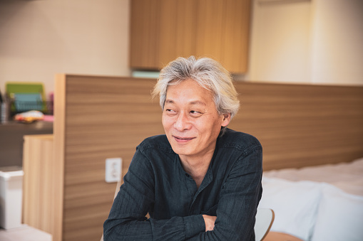 Korean man, relaxed portrait at home
