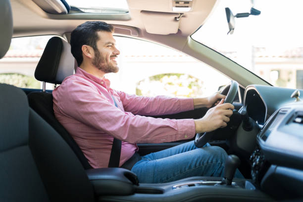 istock Happy Handsome Man Driving New Car 1205314746