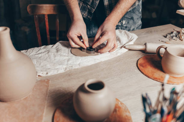 istock Potter makes clay decorations in the shape of hearts 1205314890