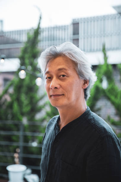istock Korean man, relaxed portrait at home looking at camera 1205315249