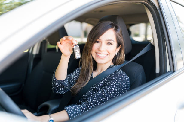 istock Smiling Beautiful Woman In New Car 1205315767
