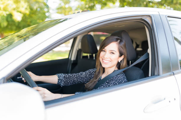 istock Confident Beautiful Woman Driving Car 1205315798