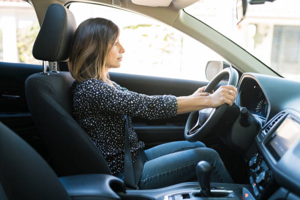 istock Woman On Driver Seat In Car 1205315836