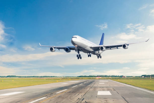 istock Passenger airplane is landing runway from airport morning flight. 1205315862