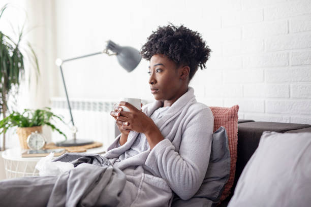 istock Woman lying in bed with virus and high temperature 1205315874