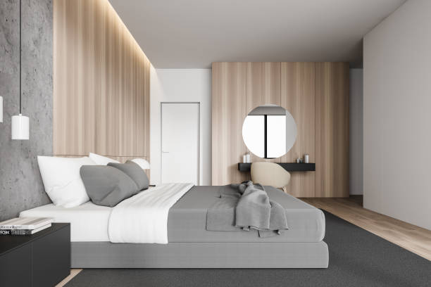 istock Wooden master bedroom with makeup table, side view 1205318058