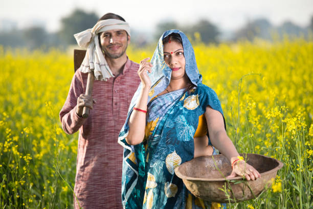 istock Rural Indian couple in rapeseed field 1205320141