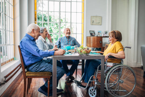 istock Seniors having meal in their retirement home 1205321303
