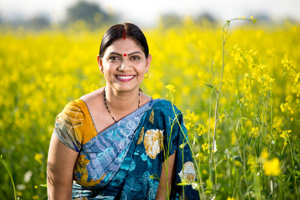 istock Woman in oilseed rape agricultural field 1205321918