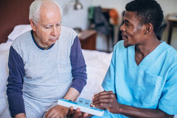 istock Nurse giving medicine  to a patient 1205325170