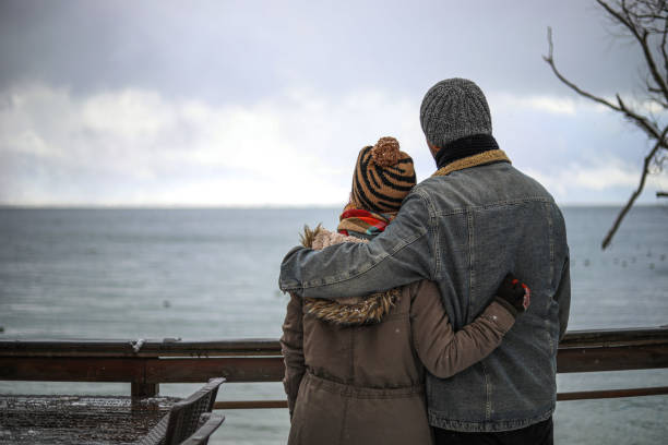 Young Lovers Embracing and Lake View