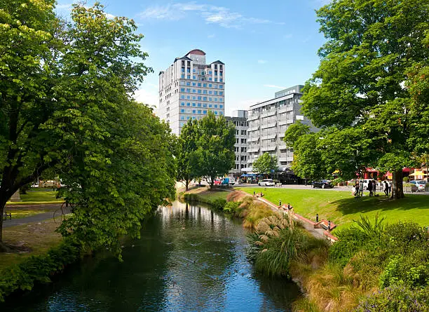 Photo of Christchurch cityscape with creek and green trees