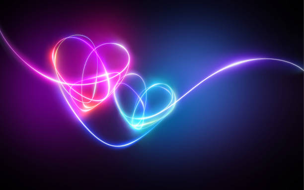 istock pink blue neon light drawing, hearts linked together. Abstract doodles isolated on dark background. Glowing single line art. Modern minimal concept. Festive illustration for Valentine day. Copy space 1205330429