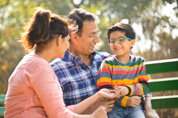 istock Happy Indian family at park 1205334673