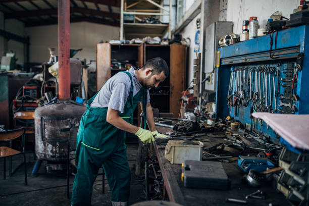 istock Young man working in metal factory 1205335285