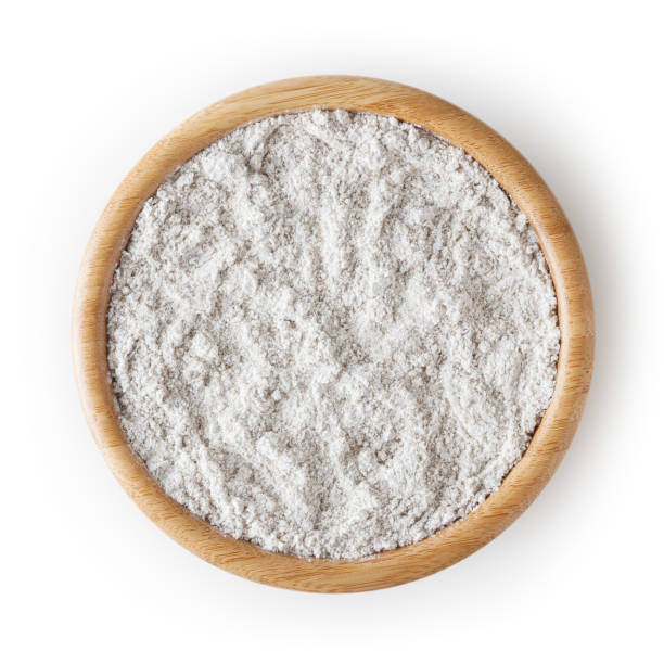 istock Rye flour in wooden bowl isolated on white background with clipping path 1205335726