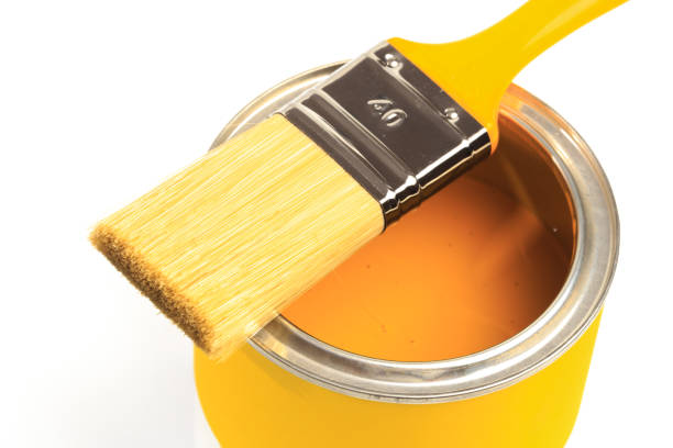istock Can with yellow paint with brush isolated on white background - Image 1205336506