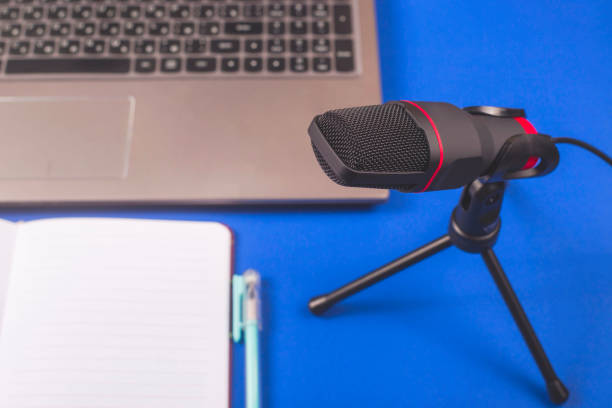 istock Microphone and notepad for recording podcast. Blogger desktop. 1205337147