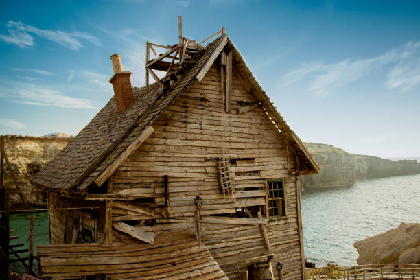 deserted haunted house on a empty field