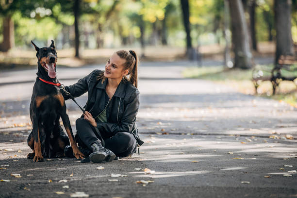 istock Woman playing with her dog 1205339062