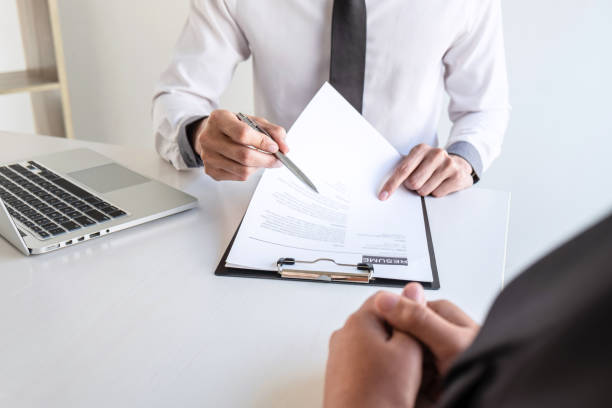 istock Business committee or interviewer consider and asking about profile of candidate, consider resume conducting a job and conversation listen to answers to thought attitude 1205339436