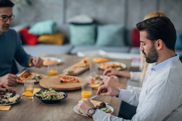 istock Friends are having tasty lunch 1205340994