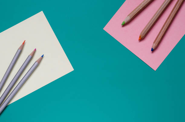 istock Two groups of colored pencils on the table. 1205342543