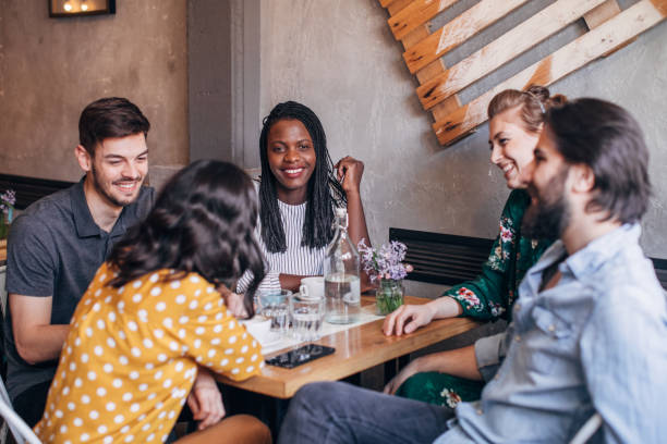 istock Young friends having fun at coffee shop 1205343097