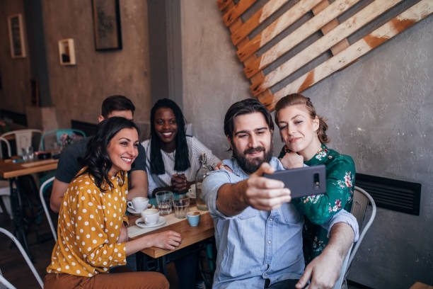 istock Friends making selfie at coffee shop 1205344195